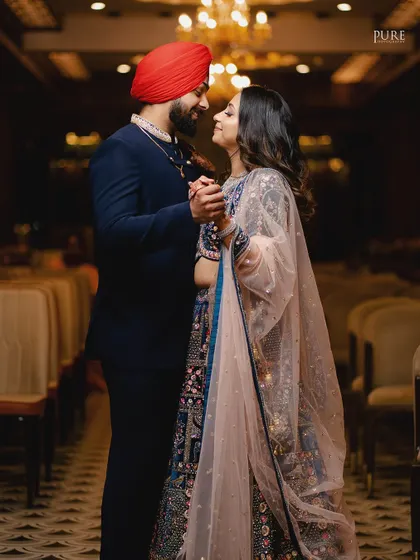A romantic dance between the newly engaged couple. The soft lighting and their happy expressions make this a beautiful, candid moment.