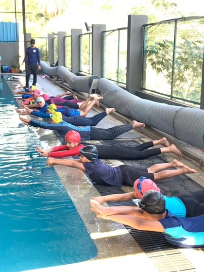 Dry-land practice for the streamline position. We focus on fundamentals to build a strong foundation for all our swimmers.