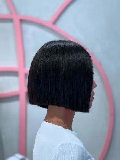 A sharp, blunt bob is all about precision. For this look, I used my clippers to create an impeccably clean line, resulting in a timeless and powerful style. This haircut is perfect for anyone wanting a chic and low maintenance look that still makes a statement.