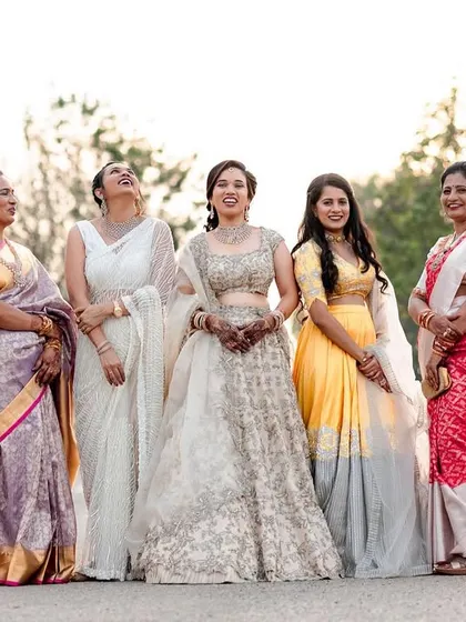 A candid moment of laughter between the bride and her family. These relaxed, happy group photos are always a favorite.