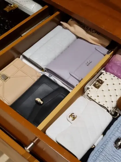 You don't need huge shelves to organize your clutches and small handbags. These images show how drawers with simple dividers can be the perfect home for your collection.