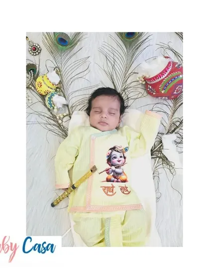 A full view of the printed Kanha set, complete with a flute prop and peacock feathers. It’s a picture perfect outfit for creating lasting memories.