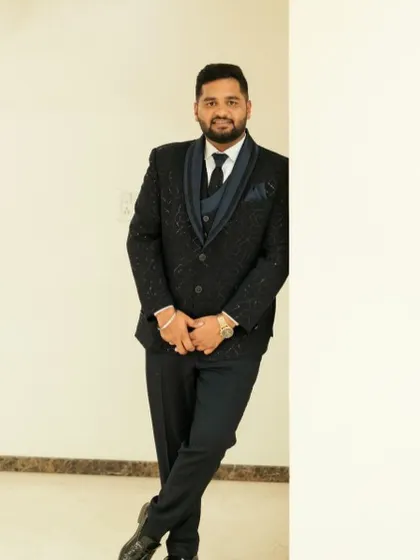 A full-length shot of the groom, ready for his reception. The makeup is undetectable and ensures he looks sharp and put-together.