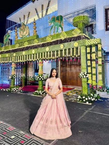 This is a traditional 'Chapara' entrance I created for a bride's home. Made from natural coconut leaves and flowers, it looks absolutely magical when lit up at night, welcoming guests with warmth and tradition.