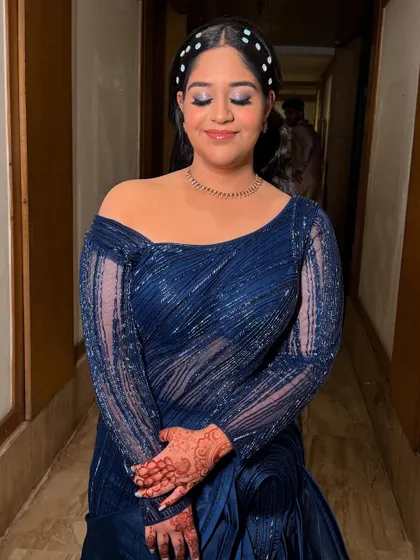 This image captures her joyful expression. The makeup is designed to be comfortable and long-lasting, so she can enjoy her event without any worries.