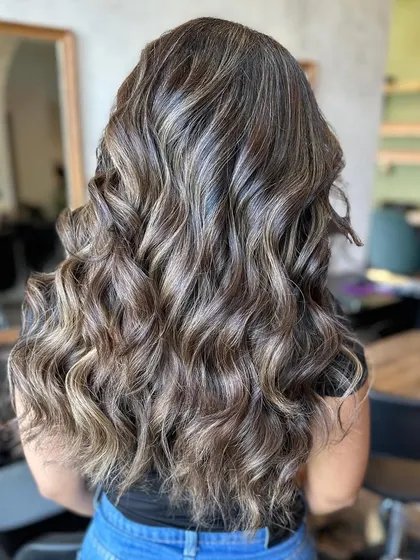 This frosty look was an 8-hour color correction. We transformed a challenging base into this beautiful, cool-toned balayage with incredible dimension.
