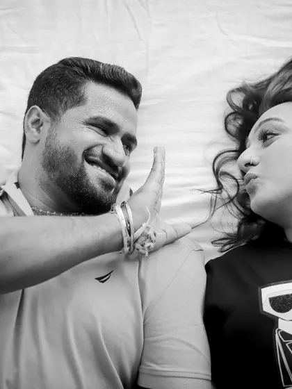 Another playful moment from the same pre-wedding shoot. The couple's fun interactions make for genuine and memorable photographs.