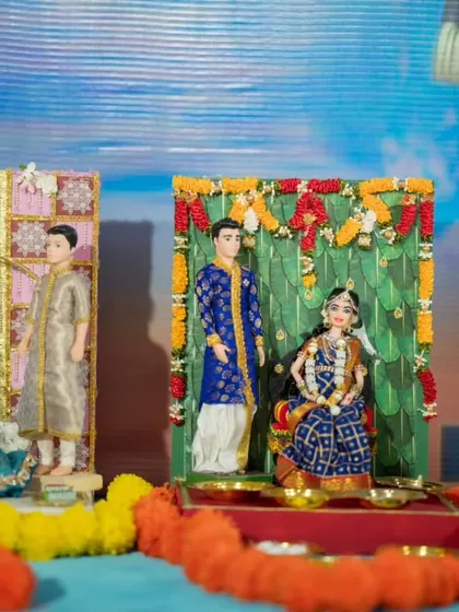 A close-up of a baby shower rukhwat scene, showing a doll on a swing, a popular and beautiful theme for 'dohale jevan'.