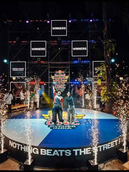The grand finale. My event photography focuses on capturing the celebratory climax, using lighting and composition to frame the winners in their moment of triumph at the Red Bull BC One Cypher.
