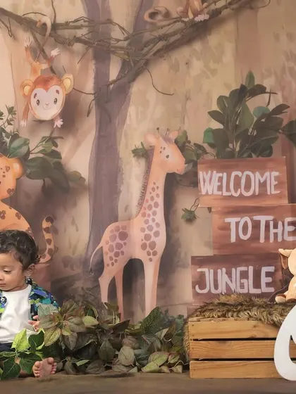 Our little explorer is one! This jungle-themed first birthday shoot is perfect for a "Wild One" celebration, complete with cute animal props and a forest backdrop.