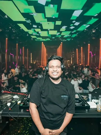 A happy moment behind the decks at Glitte. When the crowd is vibing and the music is flowing, there's no better feeling.