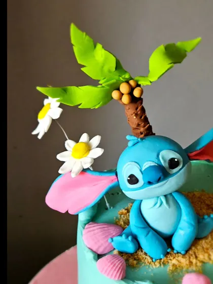 This angle highlights the expressive, handcrafted Stitch topper, capturing the character's playful and curious nature.