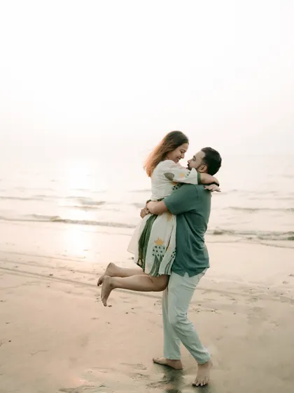 A classic, happy lift on the beach at sunset. This pose is timeless and always results in a photo filled with joy and love.