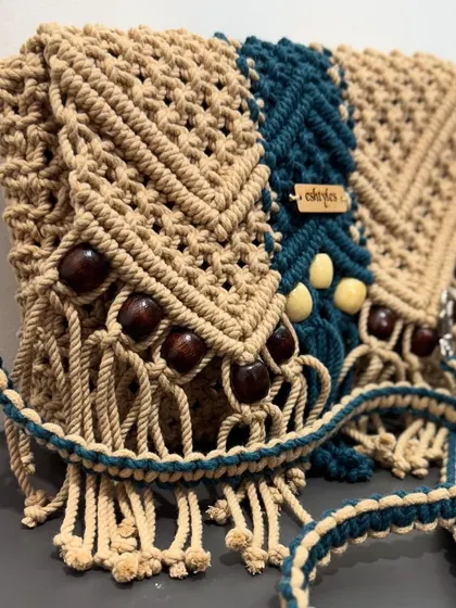 A side angle showing the fringe and bead details of the custom sling bag. Every element is chosen by the customer and handcrafted by me.