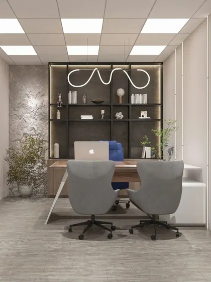 An executive cabin that combines a textured stone accent wall with clean lines and modern furniture, creating a space that is both sophisticated and grounded.