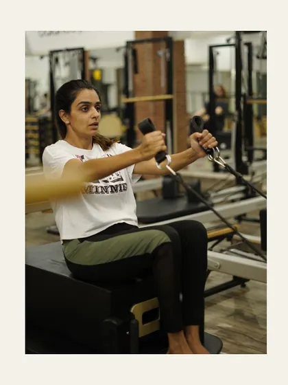 Seated arm work on the short box. This exercise is great for sculpting the shoulders and improving posture.