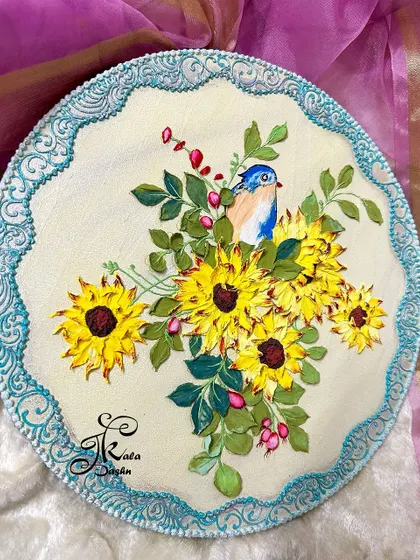 Another view of the sunflower wall plate, showing the beautiful contrast between the yellow flowers and the blue textured border.