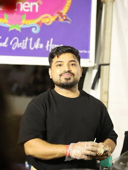 A candid shot of Ankur at our food stall, focused and ready to serve. We put our heart into every single order.