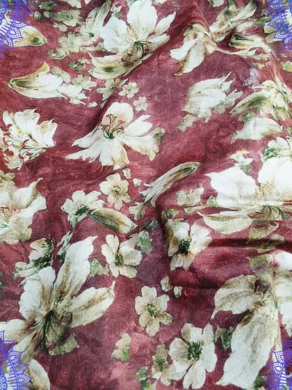 A rich maroon cotton fabric with a beautiful white floral digital print. This fabric is perfect for designing a stylish and comfortable one-piece dress or kurti.
