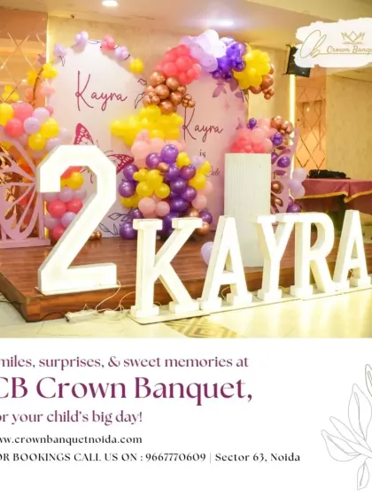 Celebrating Kayra's second birthday in style. The large light-up number '2' and name, paired with a butterfly-themed balloon arch, create a fantastic photo opportunity and a grand statement.