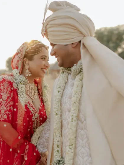 A candid moment of love between the bride and groom during their beautiful sand dune wedding ceremony in the heart of Rajasthan.