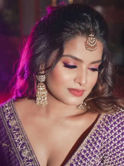 A close-up of the eye makeup. The colors are vibrant but blended softly for a romantic and glamorous feel.