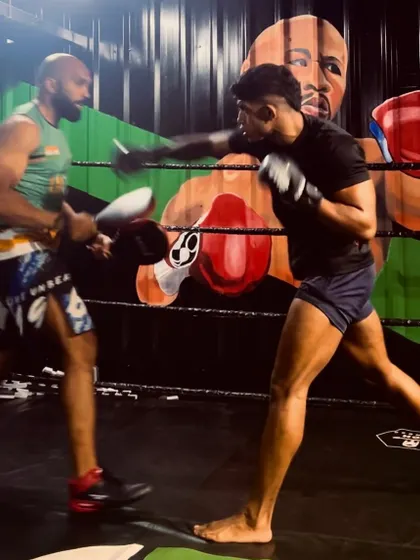 In the ring, working on boxing combinations. The mural of a legend watches over as we forge new ones.