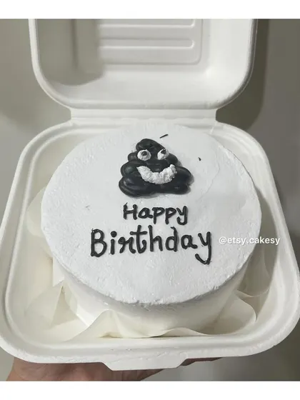 A funny poop emoji design for a lighthearted birthday bento cake.