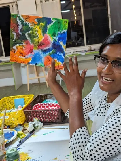 A participant excitedly explaining her abstract painting. We love hearing the stories and inspirations behind each piece.
