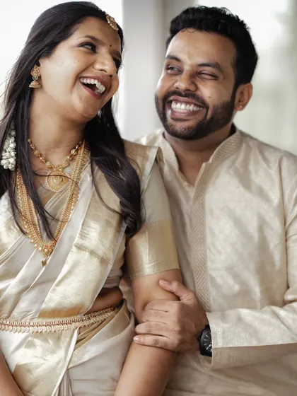 Pure, unadulterated laughter. These are the moments I live for. This candid, sepia-toned portrait captures the joy and easy comfort between the couple.