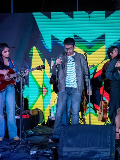 A student band lights up the stage with their energy. The annual showcase is the perfect platform for our students to experience playing in a live festival environment.