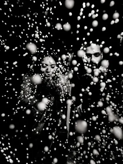 A creative black and white portrait using a spray of water to create a 'starburst' effect. This experimental technique results in a dynamic and abstract image that is full of energy.