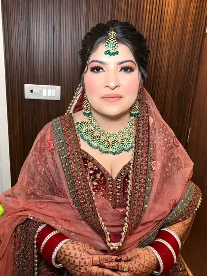 A full view of my bride Shanu's stunning maroon velvet lehenga. The makeup was designed to be soft and glowing to balance the richness of her outfit.