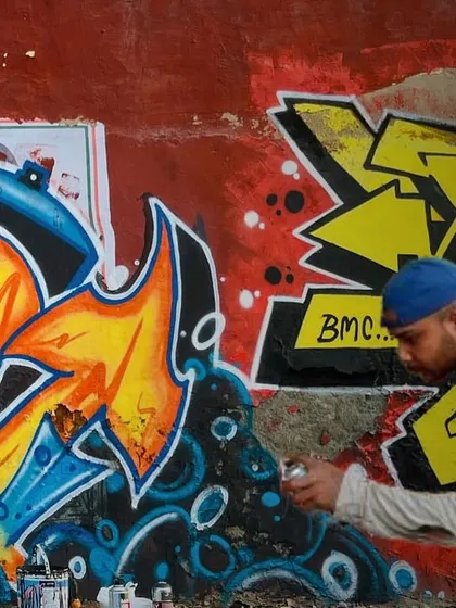 Here I am working alongside another artist on the Graffiti Dragon piece. Many of my street art projects are collaborative sessions with my crew.