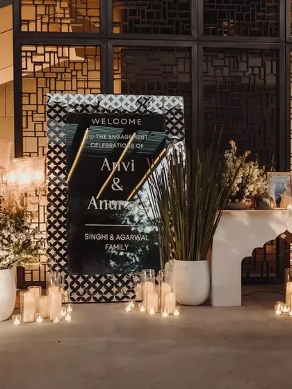First impressions matter. The entrance featured a stunning ornamental mirror signage, large crystal shamadans, and brass urlis filled with fragrant tuberoses for a welcoming, medieval charm.