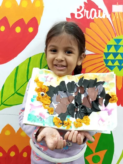 The proud smile says it all! Holding up a finished piece of art that you made yourself is a huge confidence booster for our little creators.