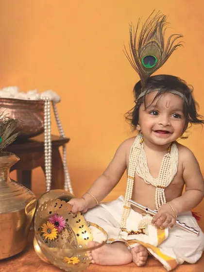 The infectious smile of a little Krishna, ready for some mischief. These sessions are perfect for babies aged 4-11 months, capturing their playful spirit in a culturally rich setting.