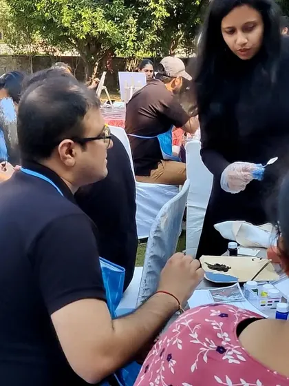 Providing one on one guidance during the corporate art event. I make sure to connect with each participant to help them with their composition and technique.