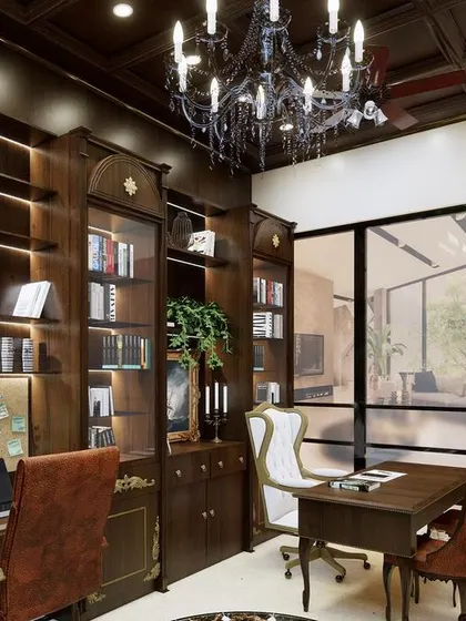 The office features extensive built-in bookshelves with glass doors, providing ample storage for a personal library. The layout includes multiple workstations, making it a functional space for more than one person.