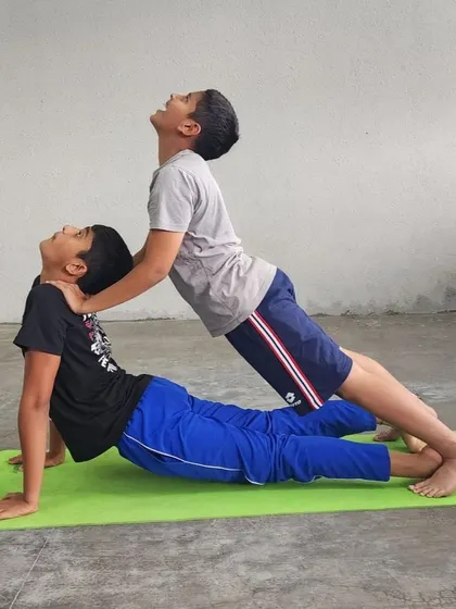 The trust and strength on display here are inspiring. The base provides a solid foundation for the flyer's graceful pose.