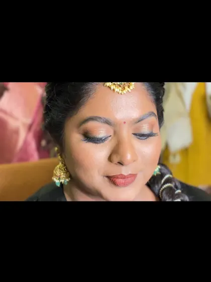 A close-up of Dr. Preetha's smokey gold eyes for her Pondicherry muhurtham. This look is perfect for brides who want defined eyes that are not overpowering.