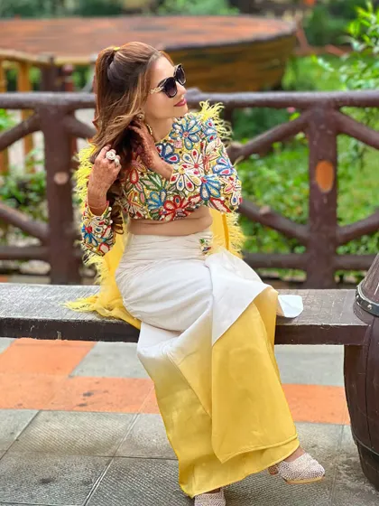 A candid shot of the client enjoying the party, looking effortlessly chic.