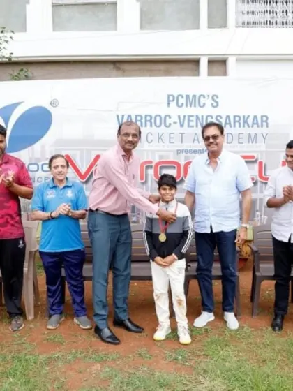 A young player receiving his award for outstanding performance in the U-12 Varroc Cup.