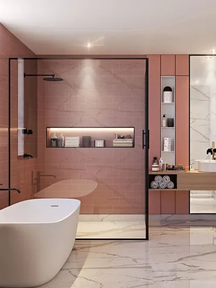 A soft and elegant bathroom with blush pink wall tiles, a freestanding tub, and black-framed glass for a modern, chic feel.