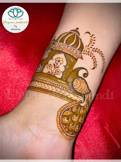 A beautiful startup design for a wrist or arm band, featuring a peacock in a jharokha (window).