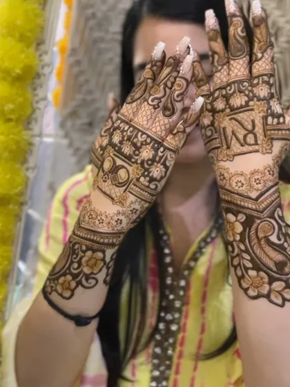 A happy client at her engagement, loving her custom mehndi design. Seeing my clients happy is the best part of my job.