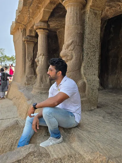 Taking a moment to admire the craftsmanship of the Pallava dynasty architects inside a cave temple.