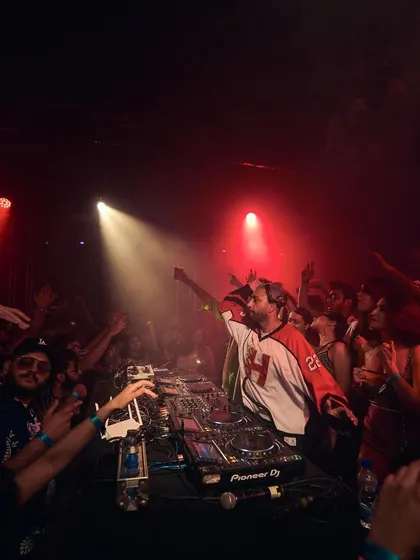 A high-energy moment from behind the decks at Boiler Room, with the crowd fully engaged.