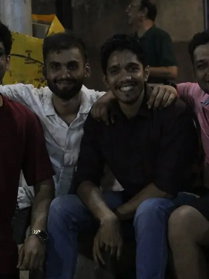 Friends and teammates enjoying the tournament from the sidelines.