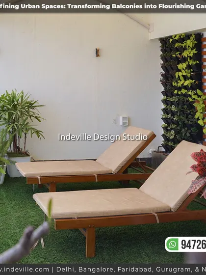 A view of the sun loungers next to a vertical garden wall. This combination of comfortable seating and dense greenery creates a resort-like feel in an urban setting.